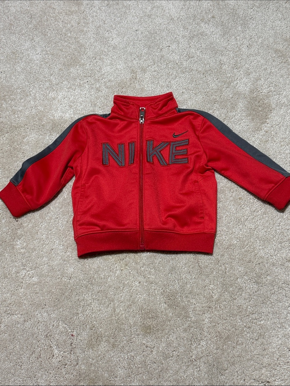 Nike Red Kids Zip Jacket with Black Stripe Accents